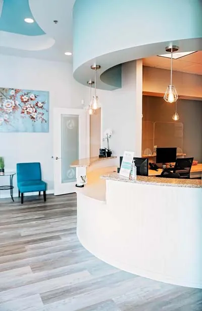 front desk and waiting room at Stonebriar Family Dentistry in Frisco, TX