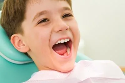 young boy laughing during his dental appointment at Stonebriar Family Dentistry in Frisco, TX