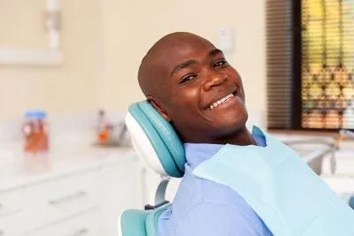 man smiling in the dental chair during his visit to Stonebriar Family Dentistry in Frisco, TX