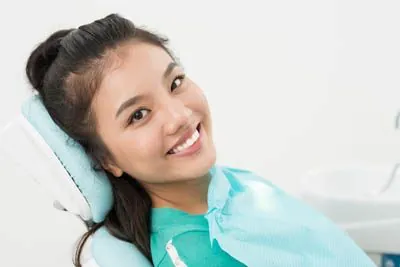 woman smiling in the dental chair at Stonebriar Family Dentistry in Frisco, TX