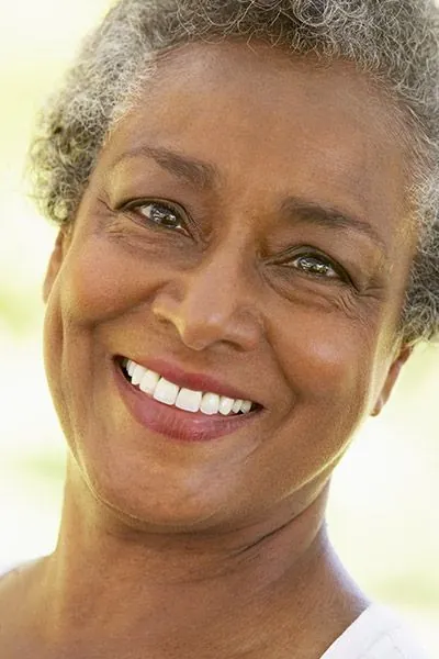 woman smiling big after getting dentures at Stonebriar Family Dentistry in Frisco, TX